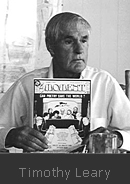 Timothy Leary holding a copy of The Moment